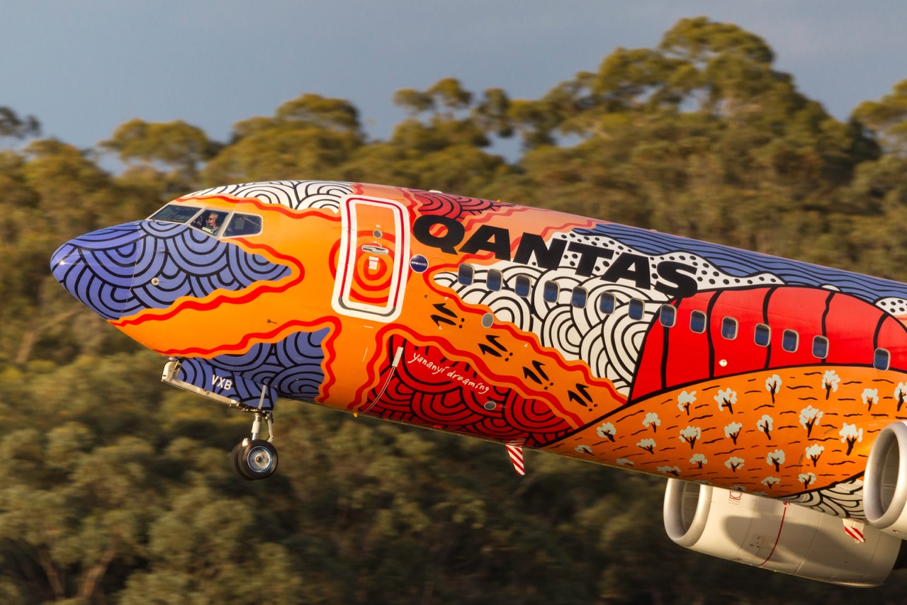 Qantas Yananyi Dreaming aircraft taxiing at Melbourne Airport - on-time chauffeur pickup