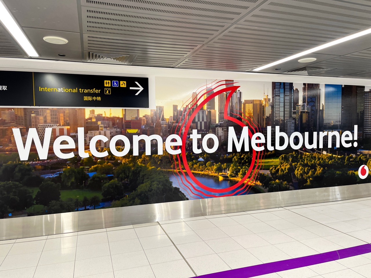 Welcome to Melbourne mural at Melbourne Airport international terminal - Royall Rides meet and greet